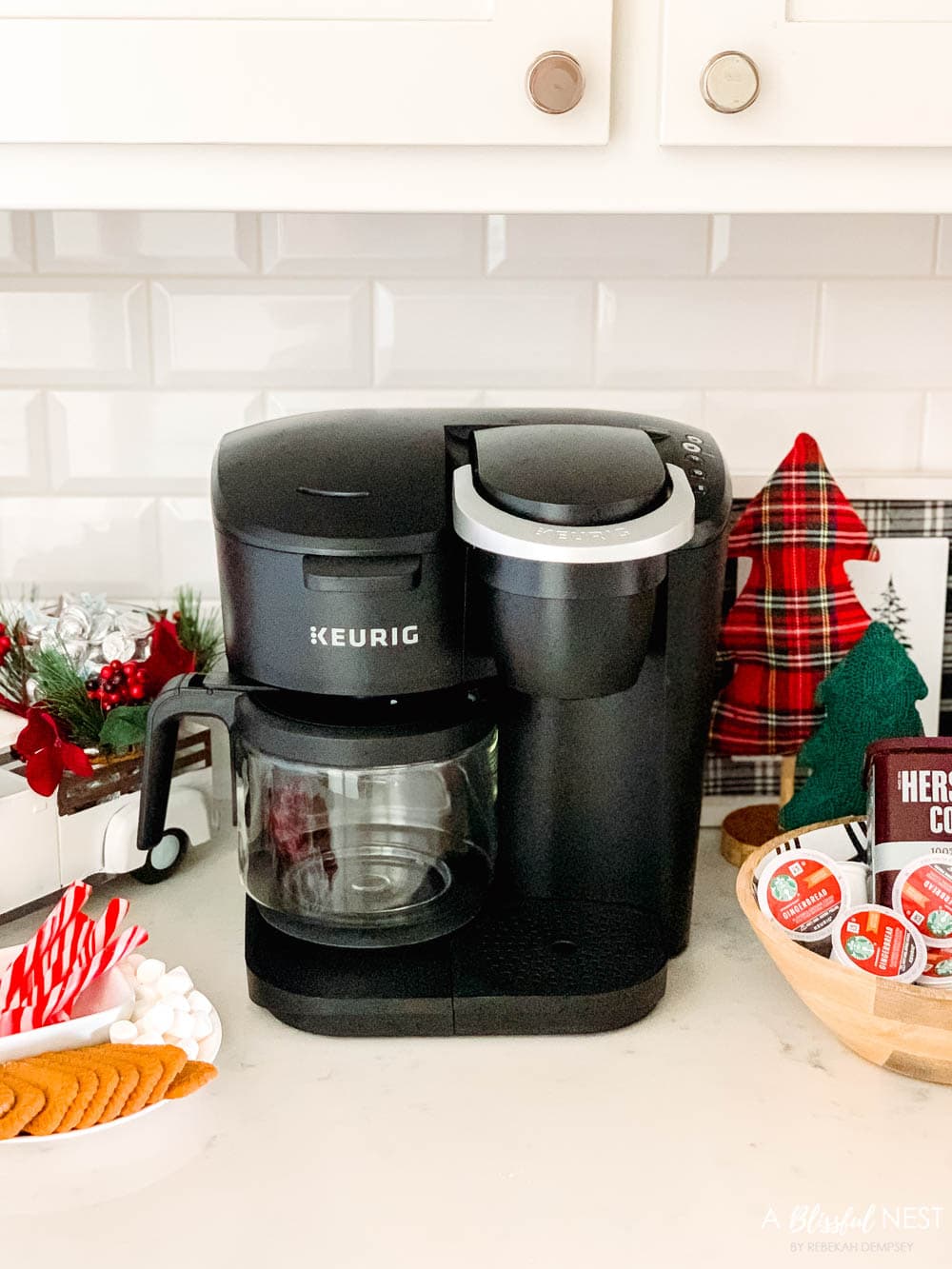 Black Keurig machine for a hot cocoa and coffee bar