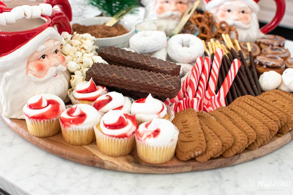 Strawberry cream mini cupcakes and biscotti on a cutting board