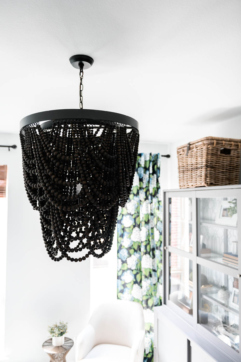 Black beaded chandelier makes a statement in this small space.