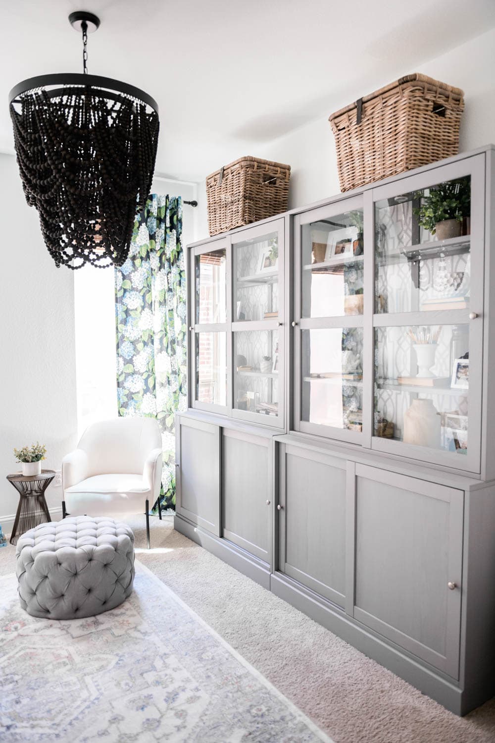 Grey cabinets from Ikea in a small home office. Add wicker baskets to top of cabinets
