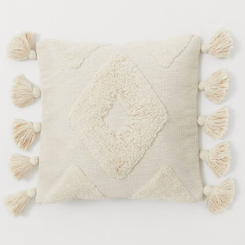 This ivory textured throw pillow has the funnest tassels ever! #ABlissfulNest