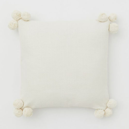 This pom pom throw pillow is under $20! #ABlissfulNest
