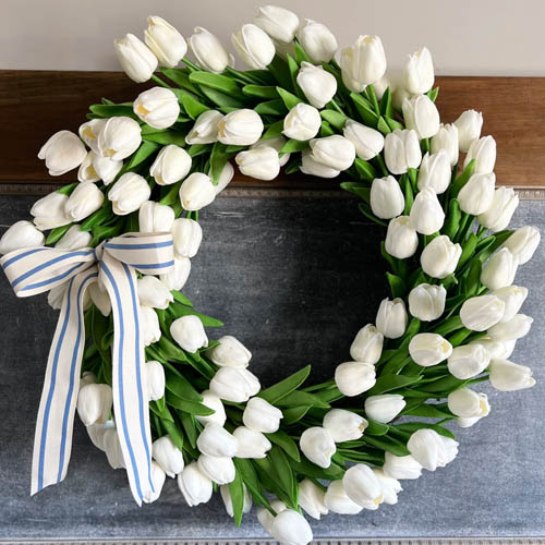 This white tulip wreath would be a stunning addition to your front door this spring! #ABlissfulNest