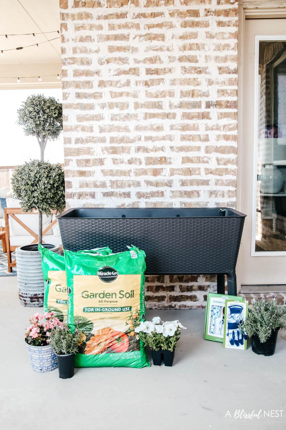 Basket weave planter on patio with potting soil and plants