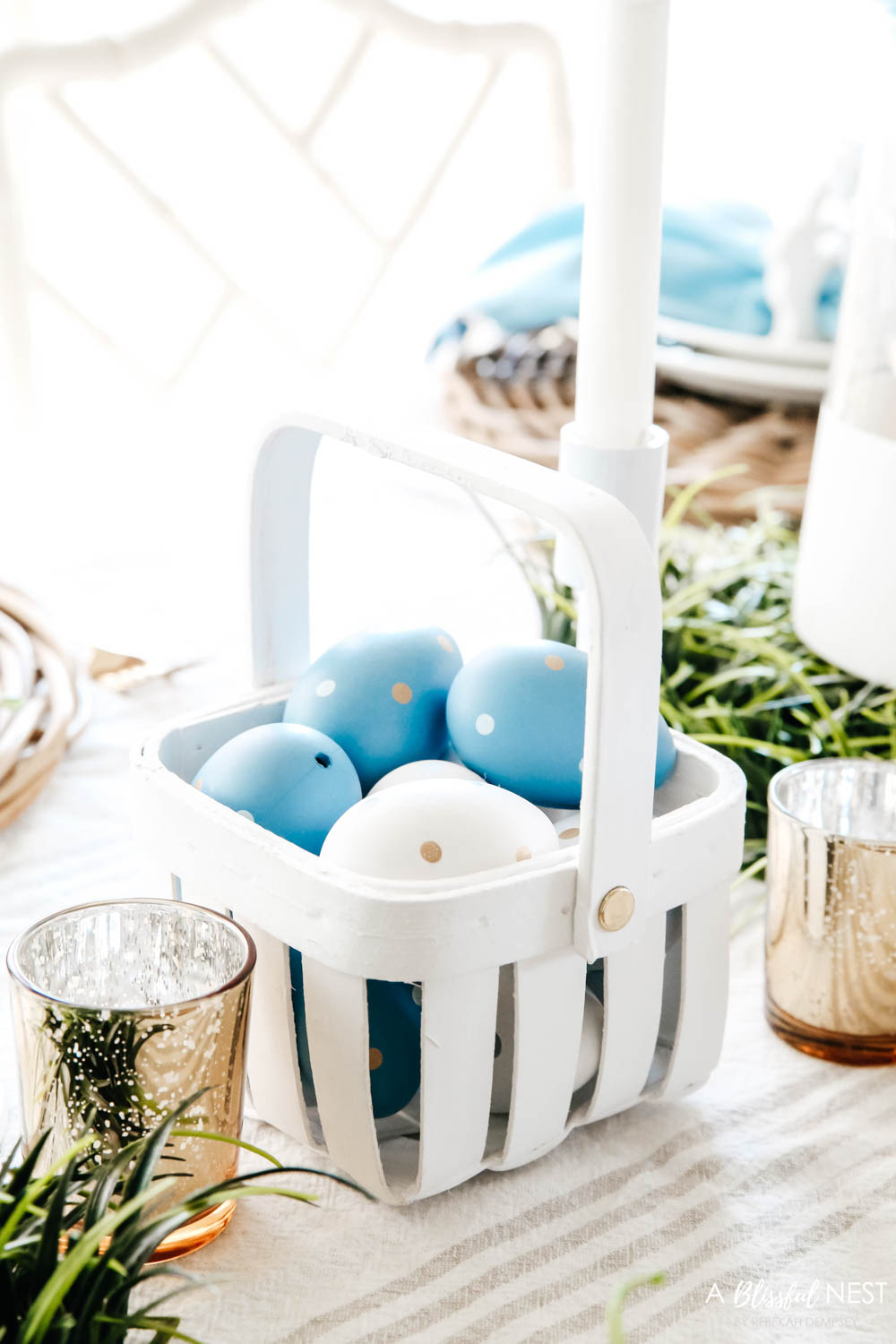 Decorate small white basket with blue and white eggs inside for decor