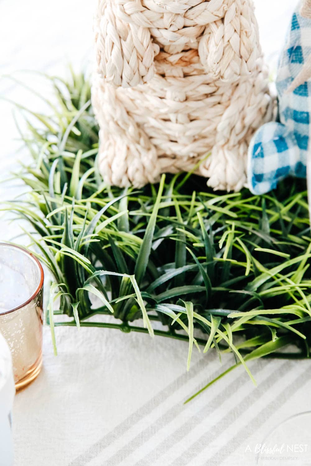 Close up detail of the grass mat used on this Easter tablescape