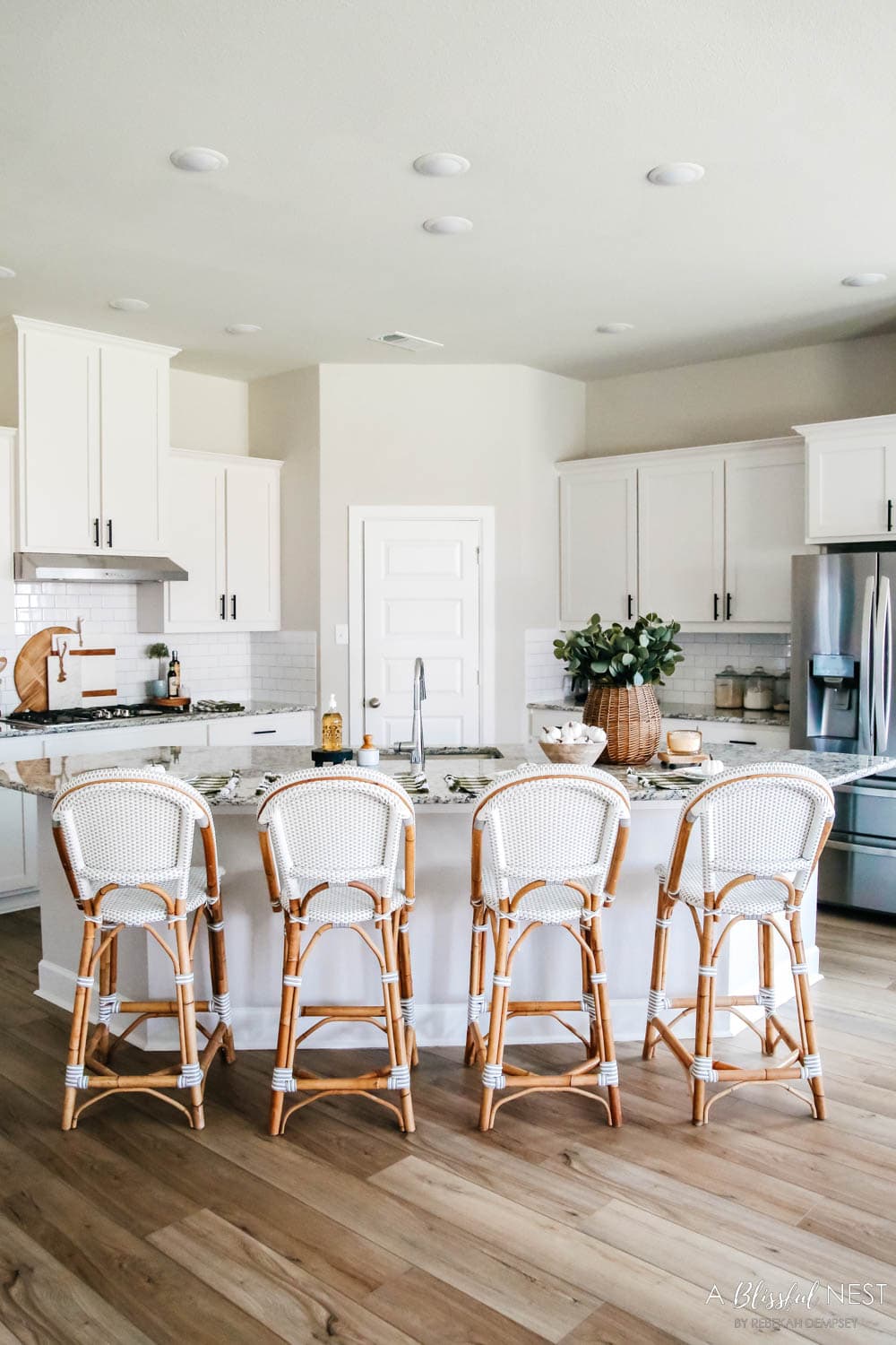 White kitchen with Serena and Lily barstools and fall decor accents.