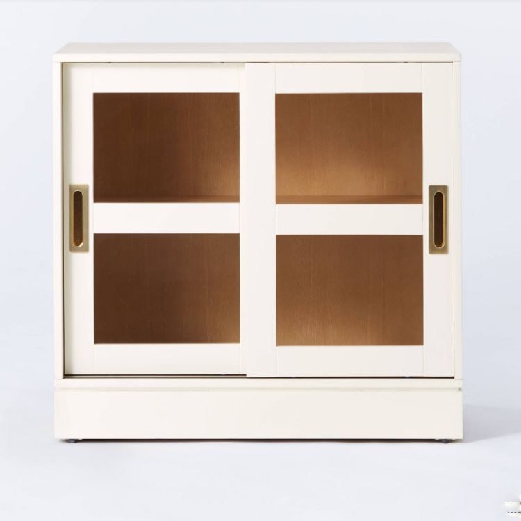 This white glass door cabinbet is the perfect piece to add to your home! #ABlissfulNest