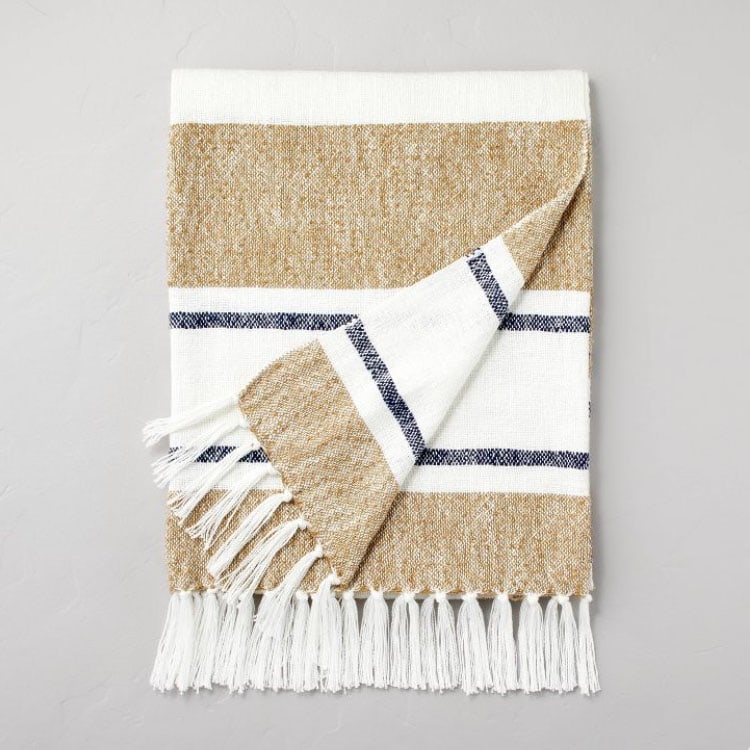 This neutral striped throw blanket is so pretty to add to your living room! #ABlissfulNest