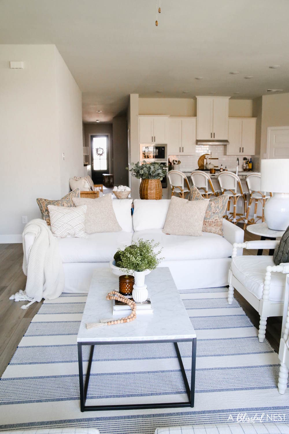 Cream colored sofa with fall colored pillows