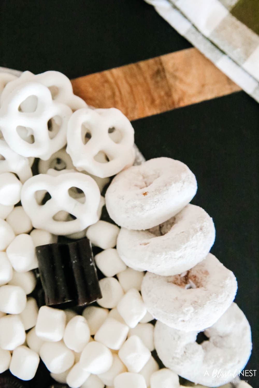 Yogurt covered pretzels, donuts and marshmallows used to fill in the board 