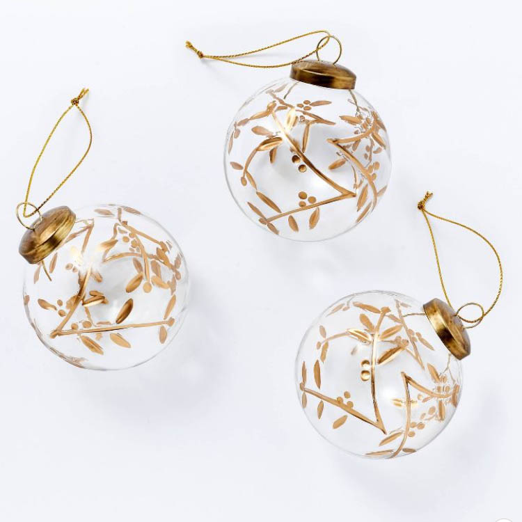 These glass ball ornaments have the most beautiful gold botanical print to them! They're the perfect tree ornaments! #ABlissfulNest