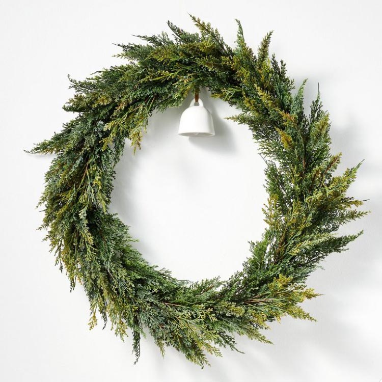 This pine wreath is simplistic and perfect for your front door this holiday season! #ABlissfulNest