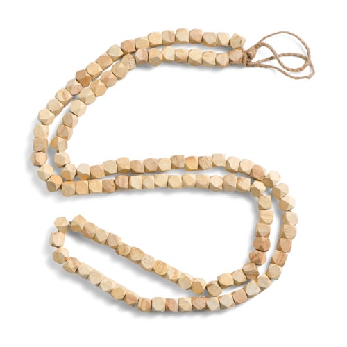 This wooden bead garland is perfect to add a finishing touch to your holiday decor! #ABlissfulNest