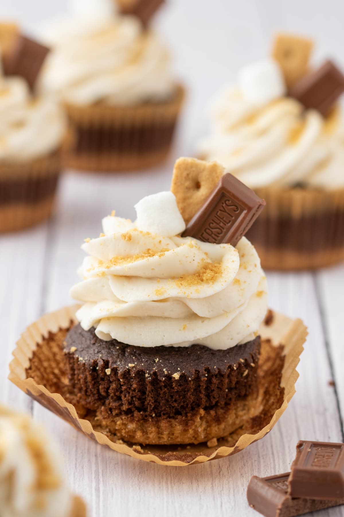 Final smore cupcake with the wrapper pulled off the sides to show the layers inside.