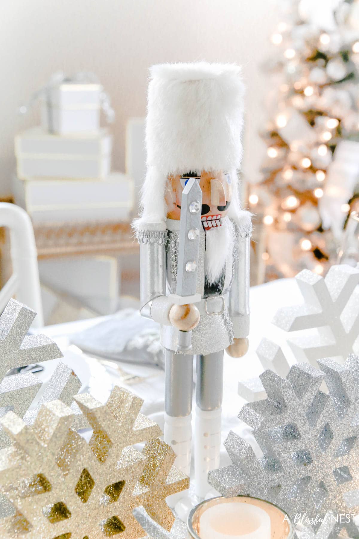 Silver glitter nutcracker used in the center of this holiday table