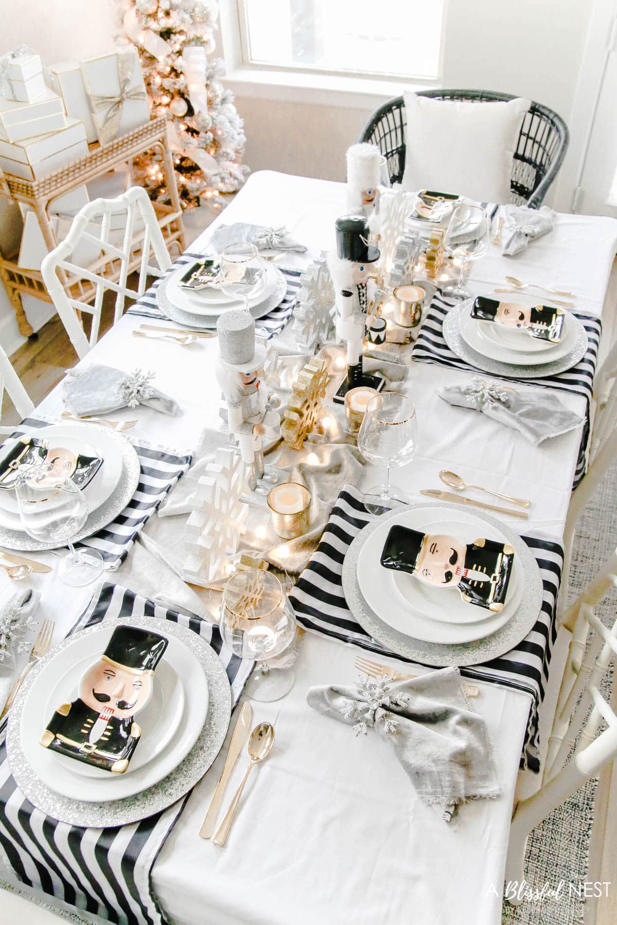 Black and white stripe fabric, nutcracker plates, gold votives, silver glitter chargers
