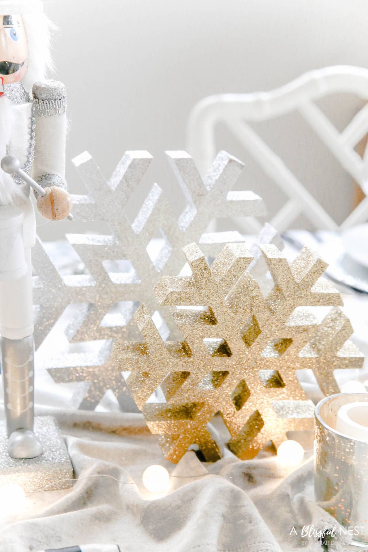 White and gold wood glitter snowflakes in varying sizes