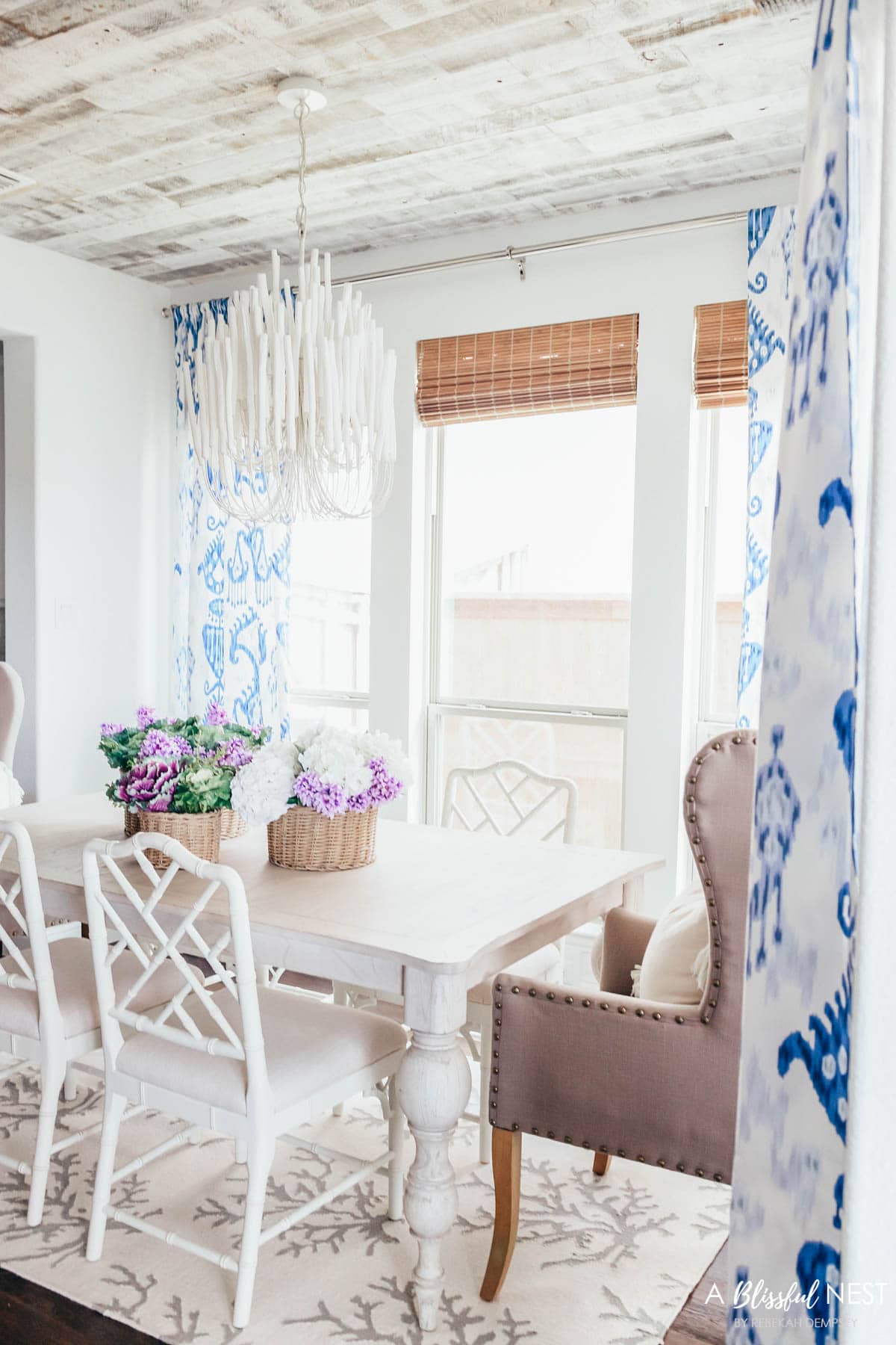 Blue and white dining room with coastal chandelier
