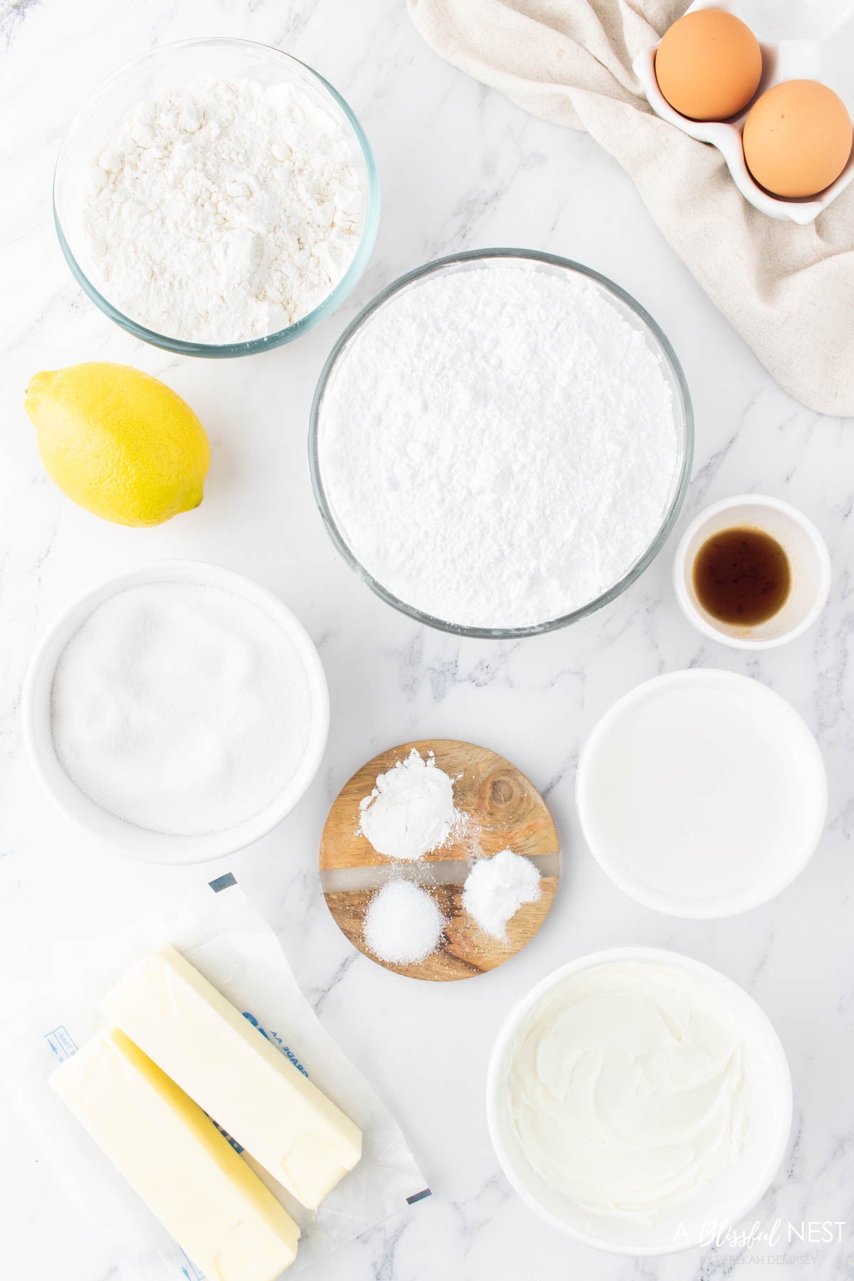 A overhead view of all the ingredients needed to make these yummy lemon cupcakes.