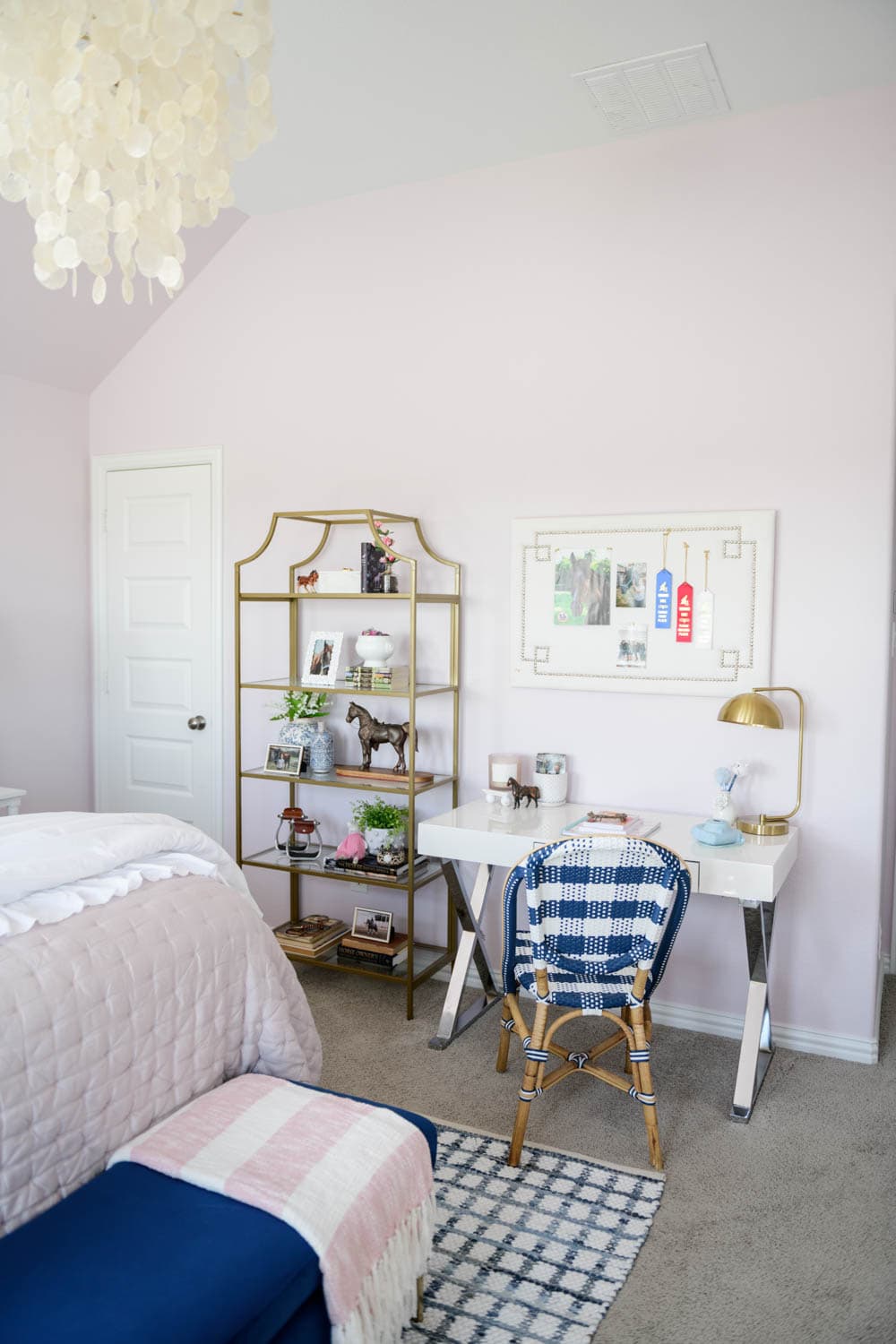 Gold bookcase next to a study space in a tween room