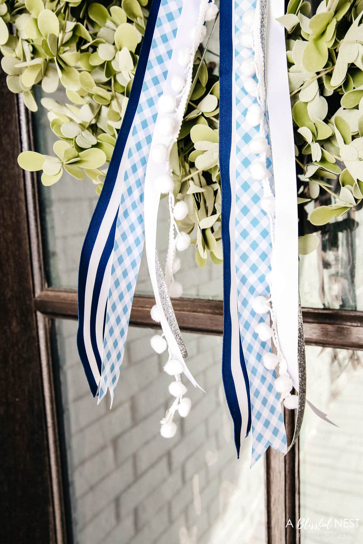 Shades of blue and white ribbons - navy blue and white stripe, blue and white gingham, thing white, and a silver ribbon.