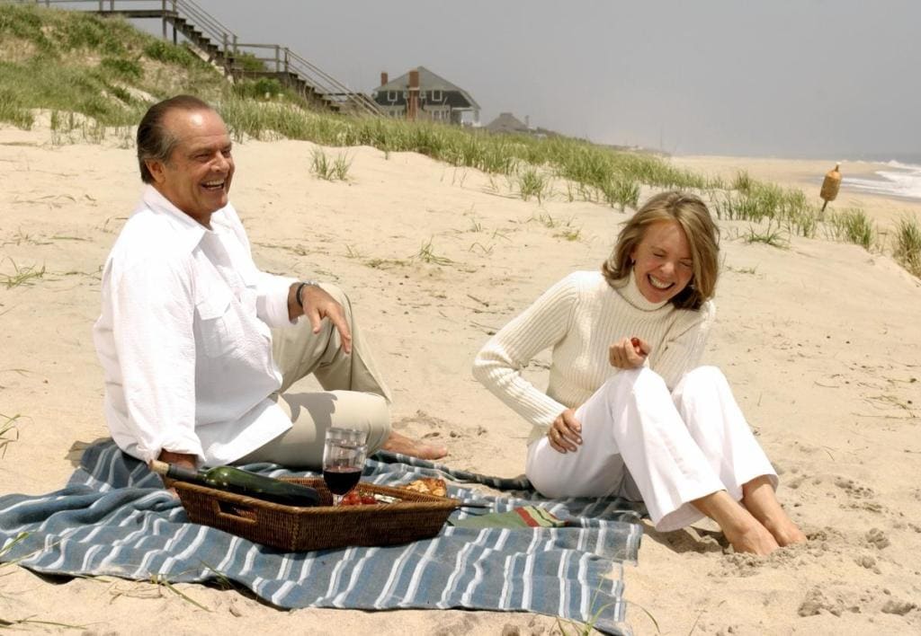 Image of Diane Keaton in a scene from the movie 'Something's Gotta Give'. She is sitting at the beach with Jack Nicolson