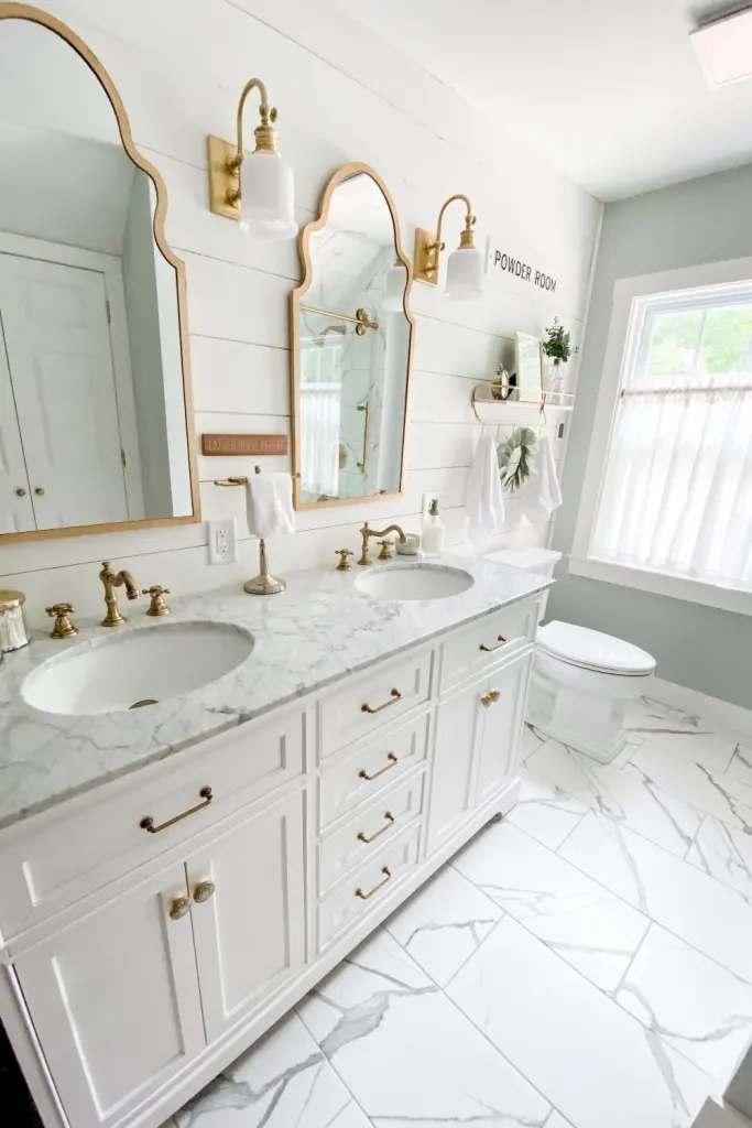 White cabinets, gold hardware and faucets, shiplap walls, mint green walls.