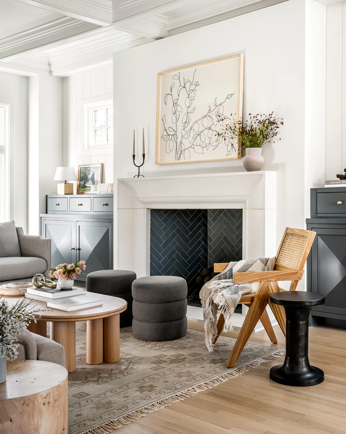 white fireplace surround with black brick inside. 