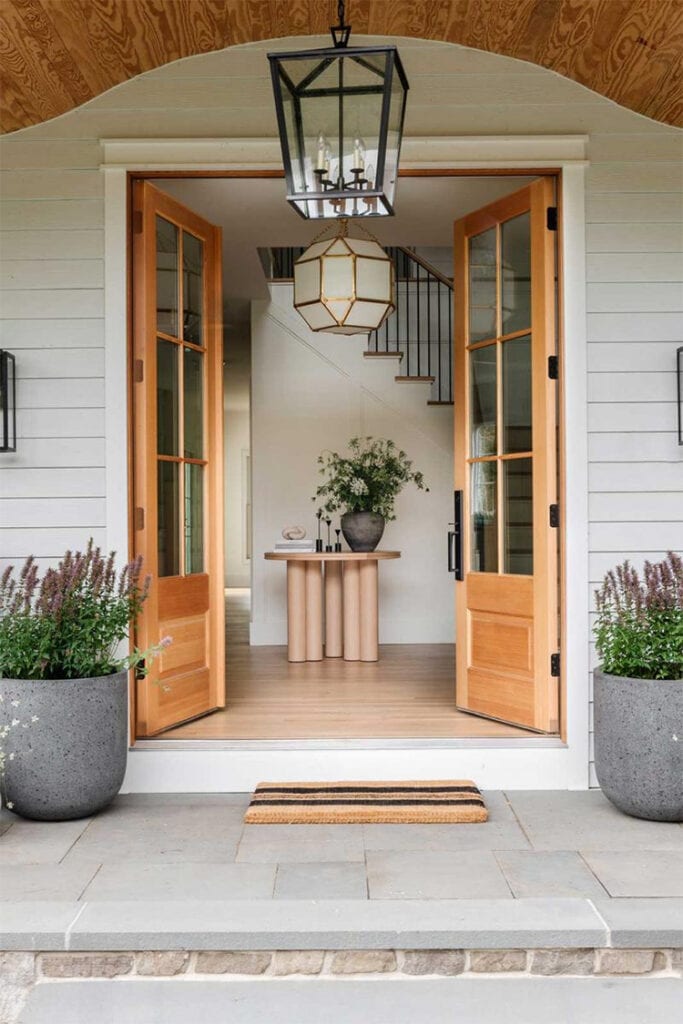 I love this entryway designed by MIF Designs! The double front doors are such a stunning entryway to a beautiful home! #ABlissfulNest