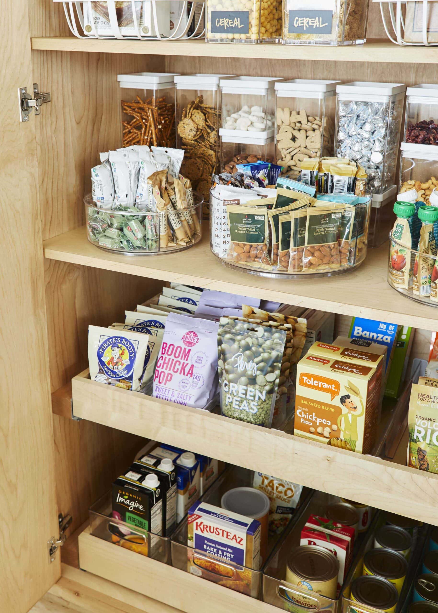 Pantry shelves using lazy susans for organization and to corral items.