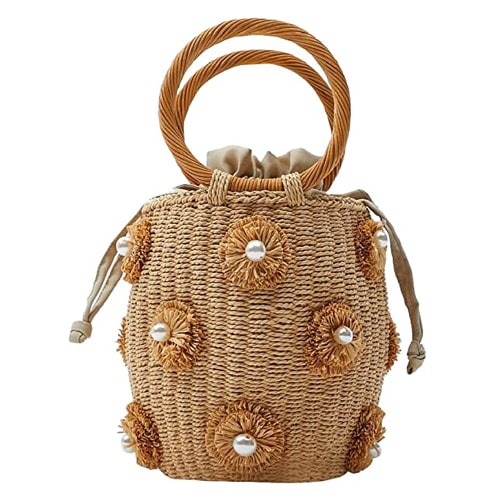 This flower embellished rattan tote is the perfect summer handbag! #ABlissfulNest