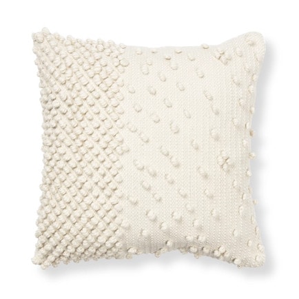 This ivory textured throw pillow is perfect for spring and under $15! #ABlissfulNest
