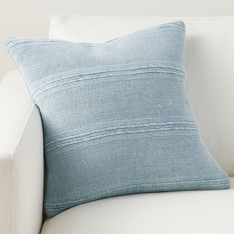 This blue striped throw pillow is perfect to add to your living room this summer! #ABlissfulNest