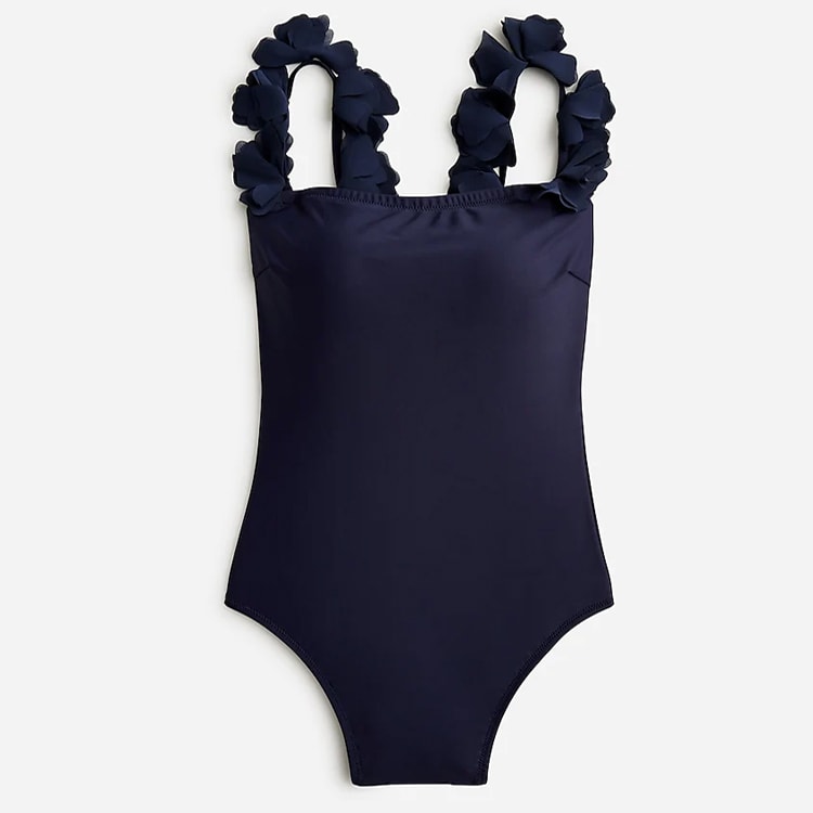 This navy one piece swimsuit has the prettiest flower straps - it's the perfect flattering one piece swimsuit for summer! #ABlissfulNest