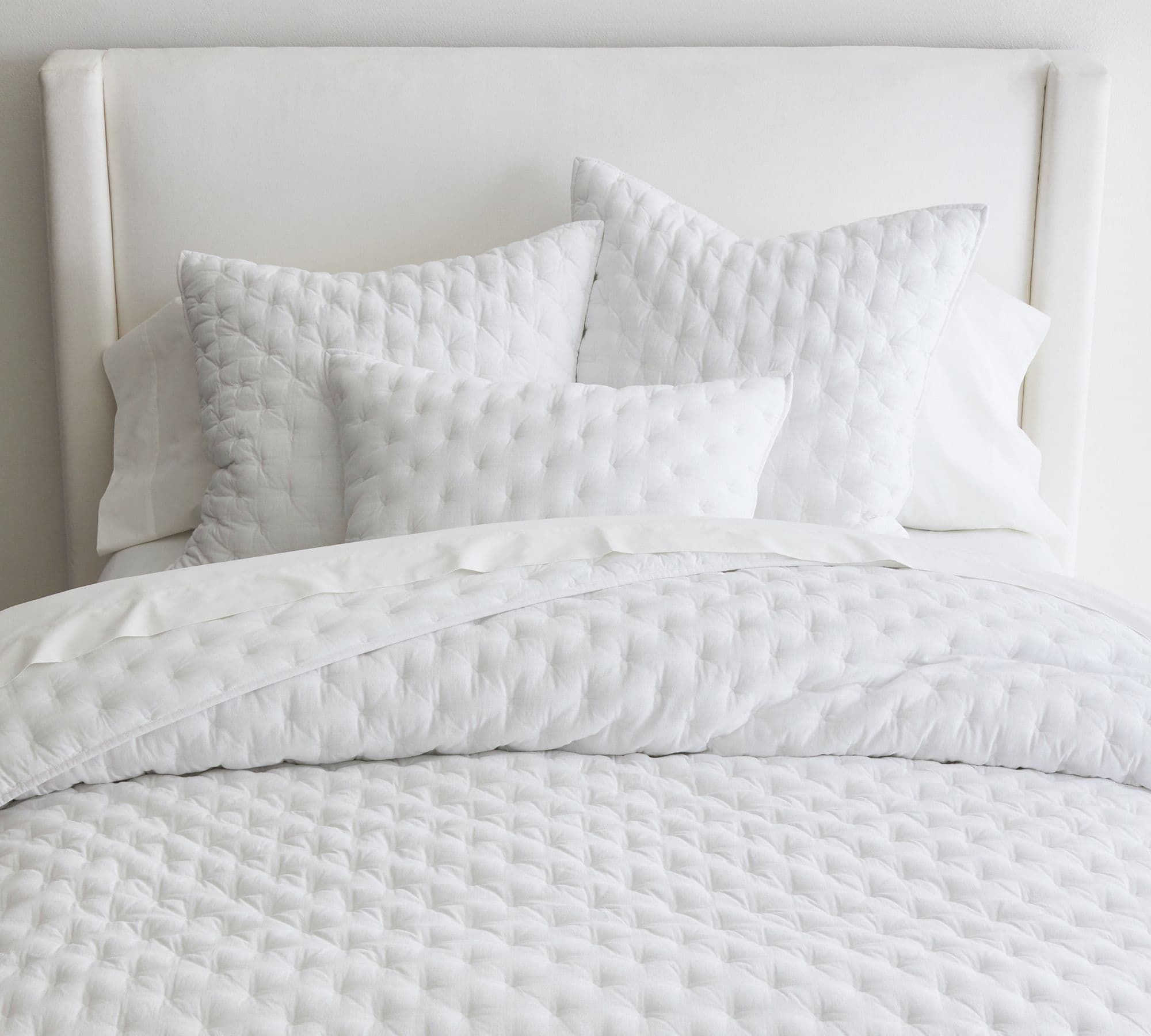 white comforter and bedding