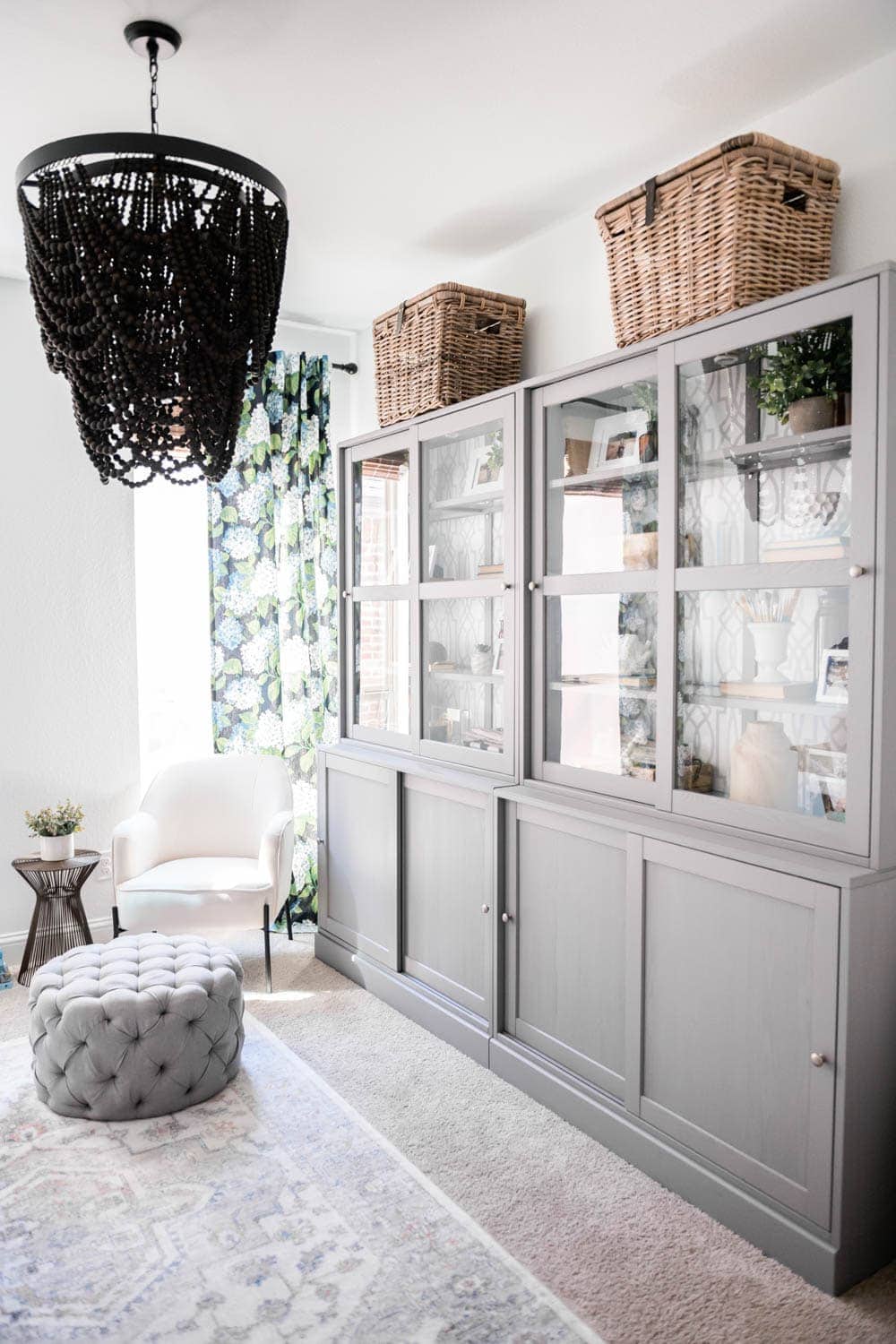 grey tall cabinet in home office organizes and hides all the clutter