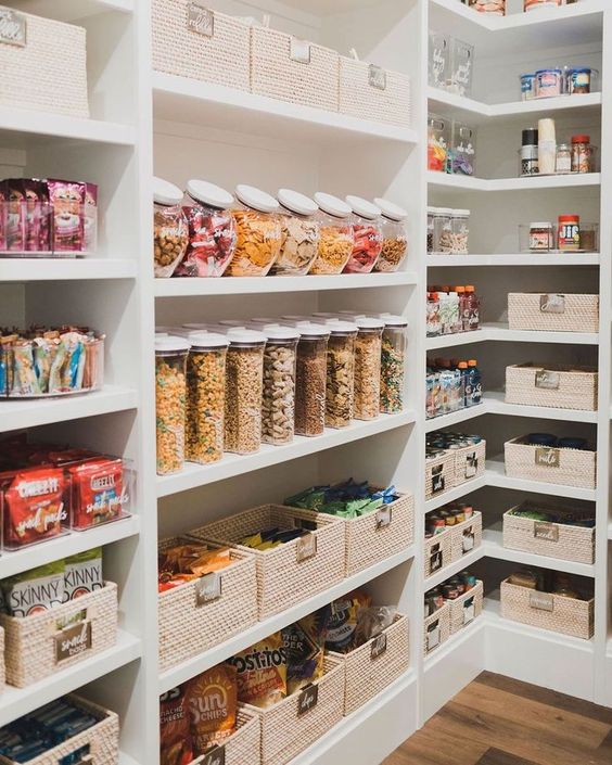 Baskets, jars, and clear containers keep this pantry clutter free