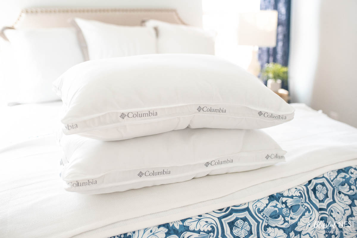 stack of bedding pillow fills on a bed