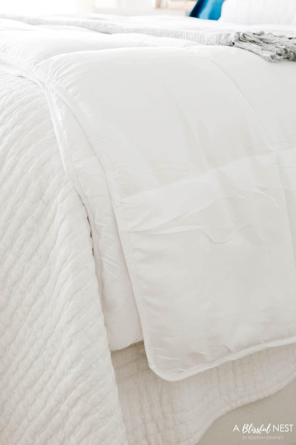 layers of a coverlet and a quilt to create extra warmth