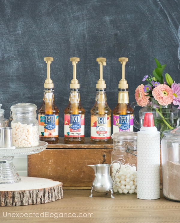 Syrups for coffee making on a counter with jars of marshmallows and cool whip
