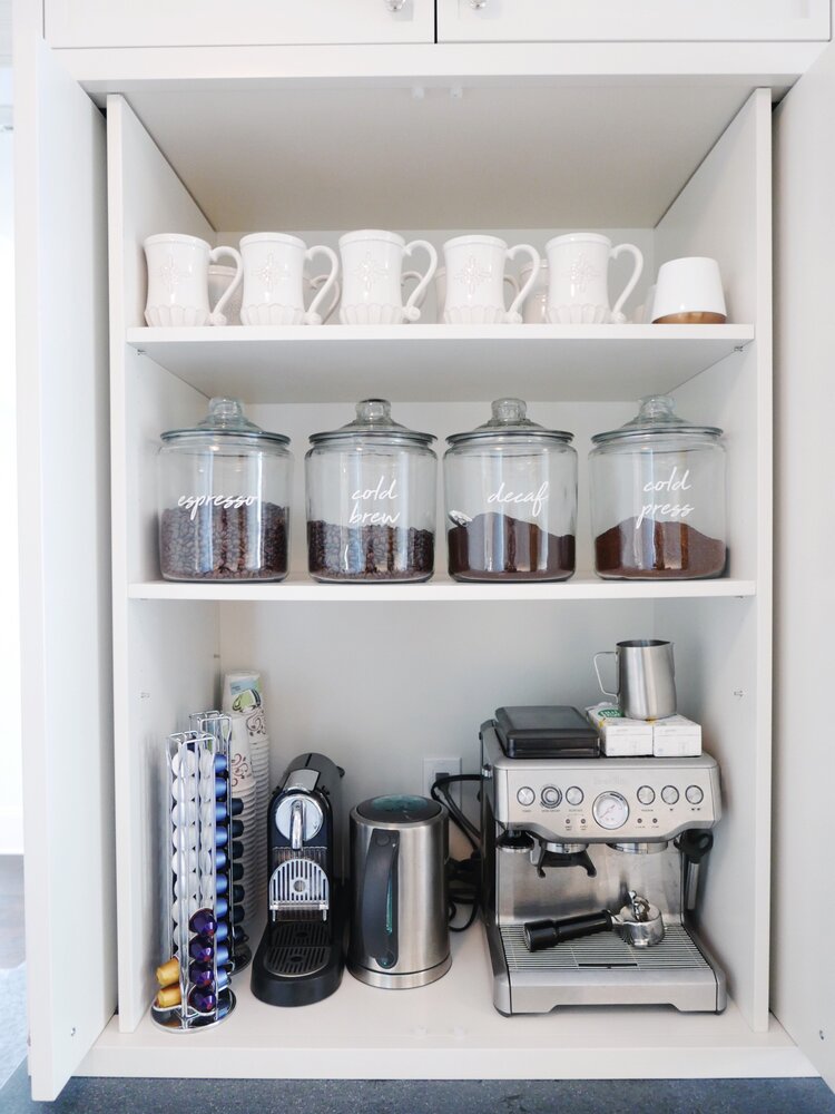 coffee cabinet with multiple canisters for different kinds of coffee