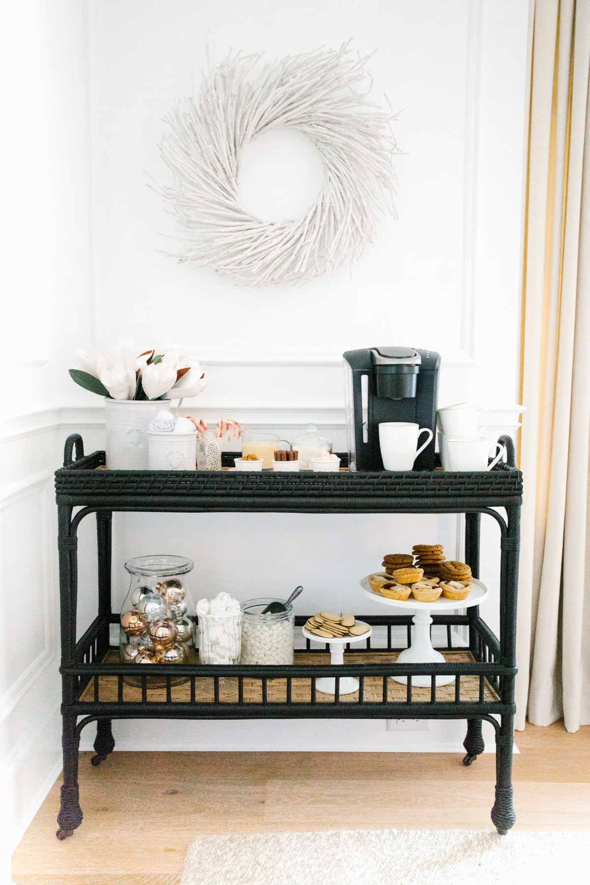 rattan bar cart turned into a coffee bar in the side of a living room