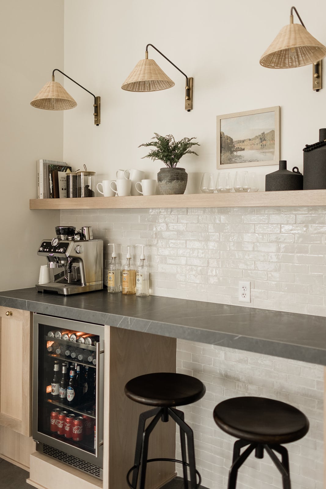 Bar area in a kitchen converted to a coffee station with a drink refrigerator below.