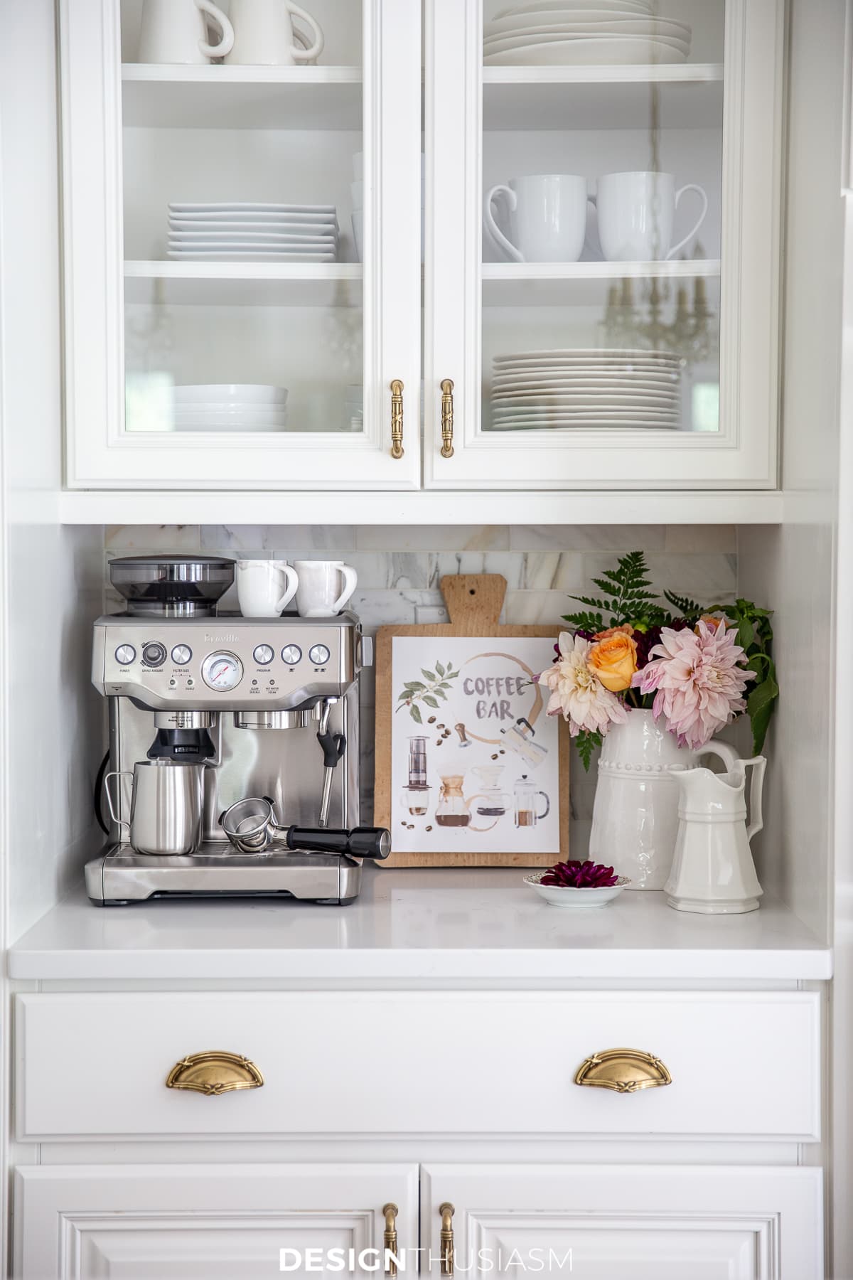 personalized coffee bar with fun artwork, flowers, and a bowl with flowers.