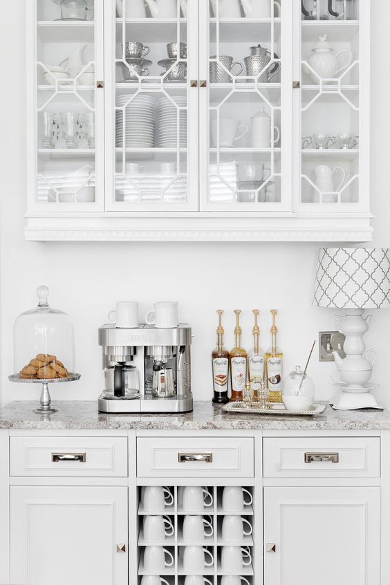 coffee bar on the counter in a all white kitchen