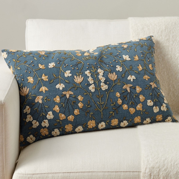 This blue floral embroidered throw pillow is a must have home decor find! #ABlissfulNest