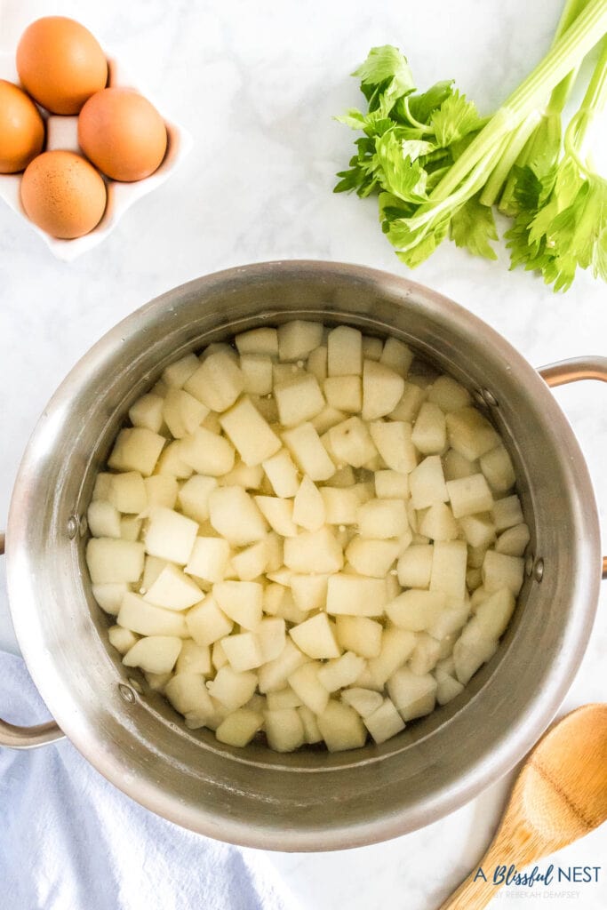 cubed potatoes in a pot being boiled