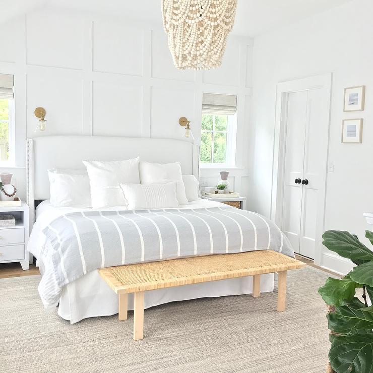 board and batten behind a white upholstered bed