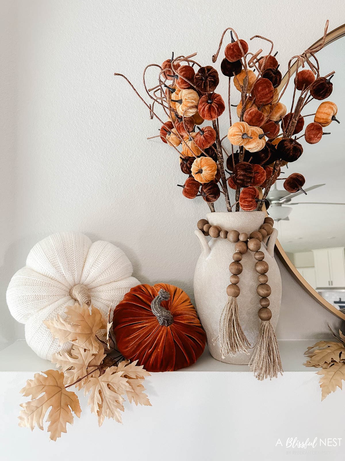 rustic vase with velvet pumpkin picks